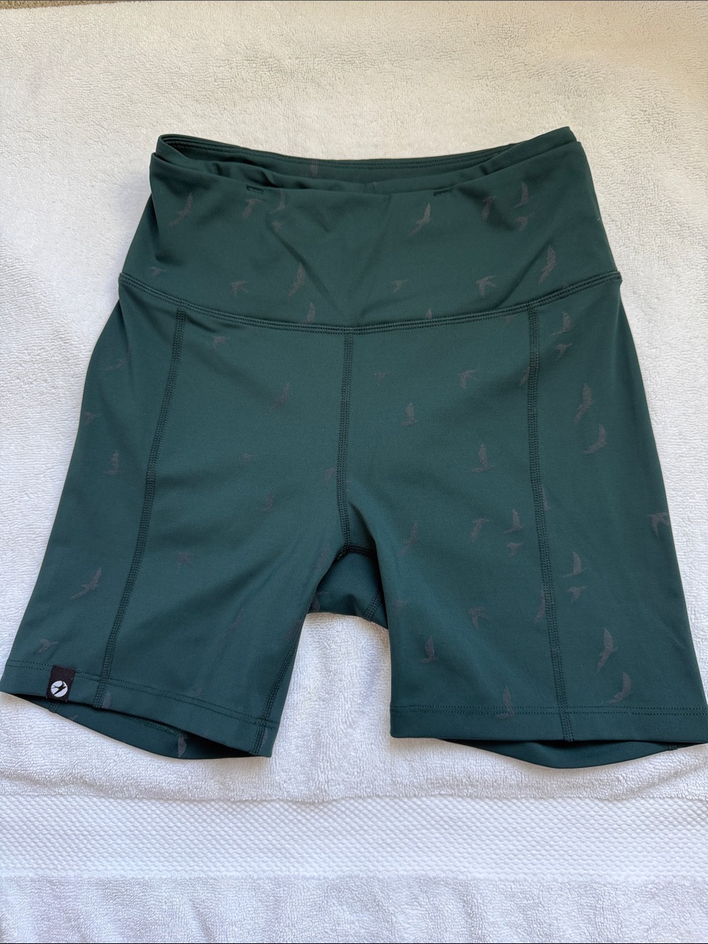 oiselle Deep Green High-Rise Shorts with Subtle Bird Print